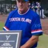 Coach with an award plaque
